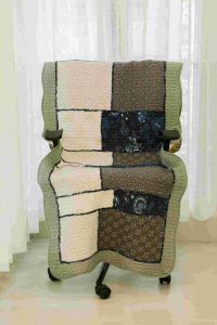Sage green patterned quilted�chair sujni