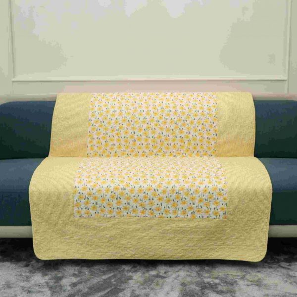 Floral yellow quilted sofa sujni