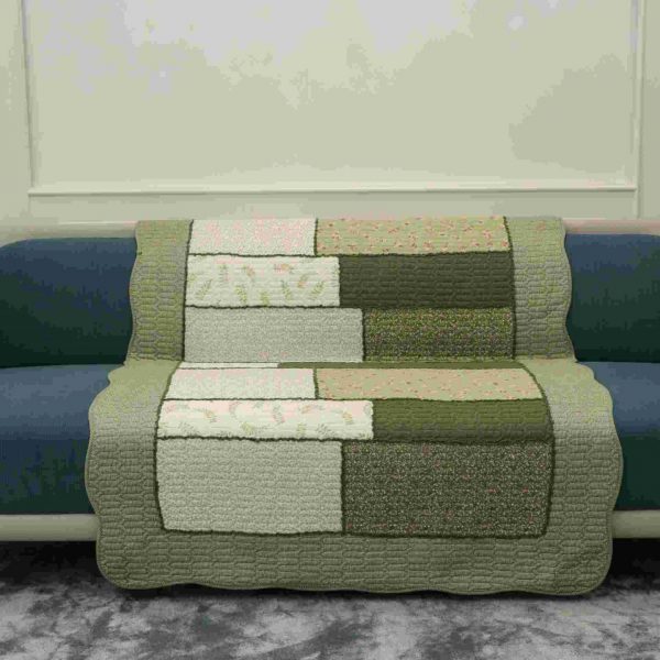 Patterned shade of green quilted sofa sujni