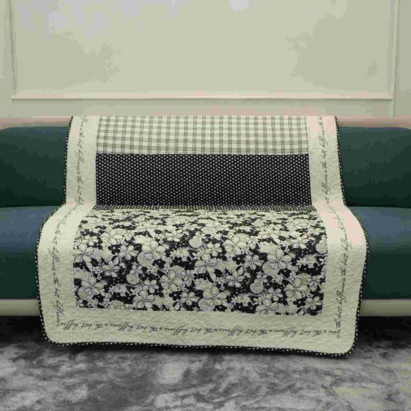 Black and white patterned quilted sofa sujni