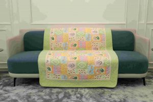 Pastel green and pink flower quilted sofa sujni