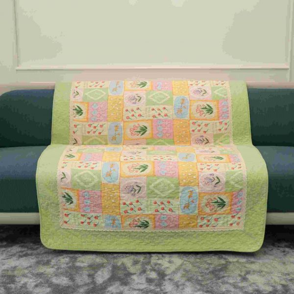 Pastel green and pink flower quilted sofa sujni